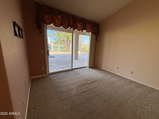 a view of an empty room with a sliding door