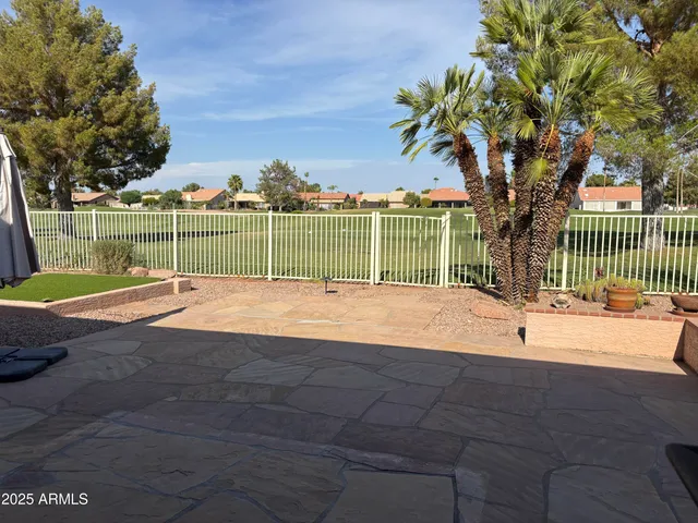 a view of a backyard with entertaining space