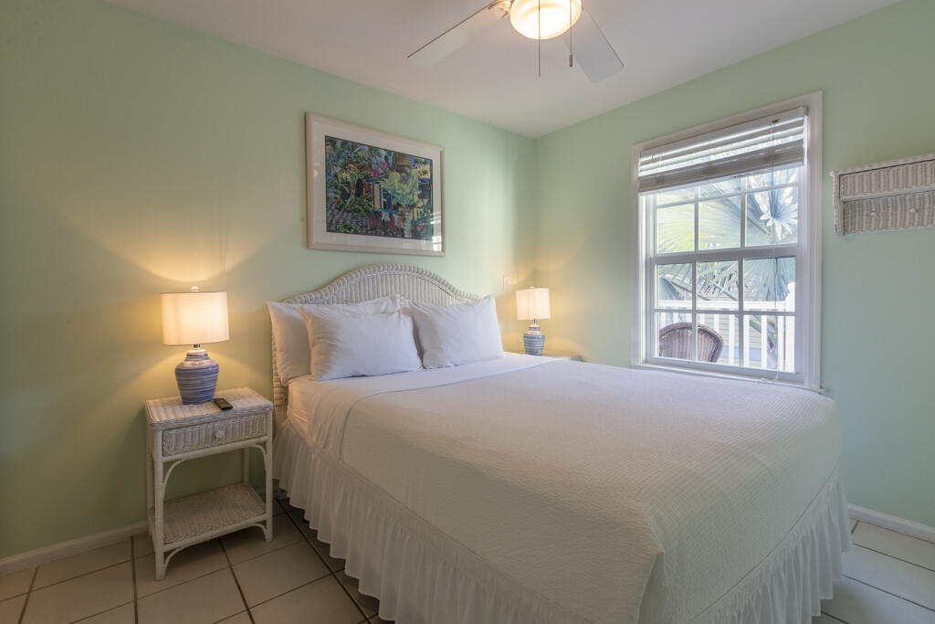 620 Thomas Street, Unit 291 Key West, FL 33040 - Photo 15 of 21 a bedroom with a bed and a window