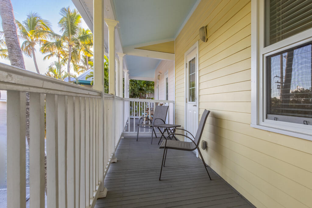 620 Thomas Street, Unit 291 Key West, FL 33040 - Photo 17 of 21 a view of a balcony with furniture