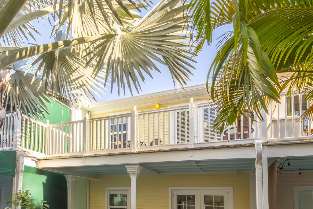 620 Thomas Street, Unit 291 Key West, FL 33040 - Photo 2 of 21 a view of a house with a windows and a palm tree