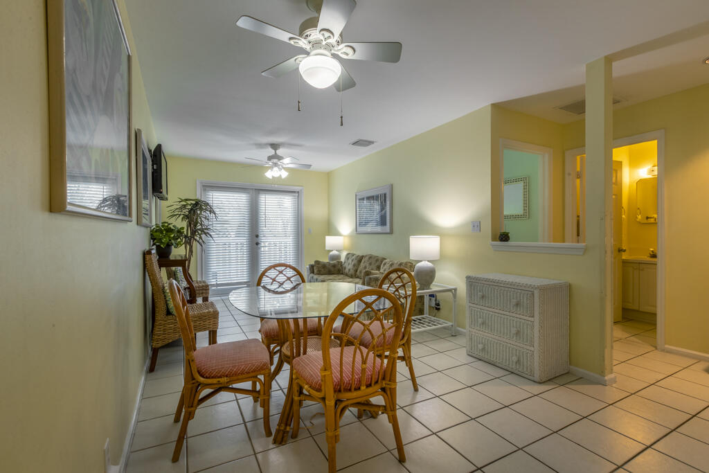 620 Thomas Street, Unit 291 Key West, FL 33040 - Photo 3 of 21 a view of a dining room with furniture and chandelier