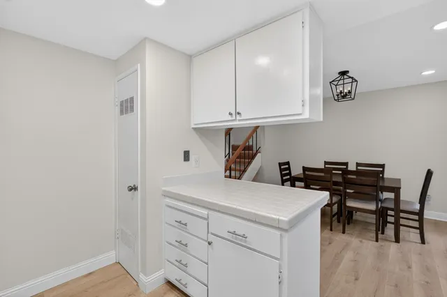 a room with a table and chairs