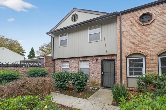 a front view of a house with garage