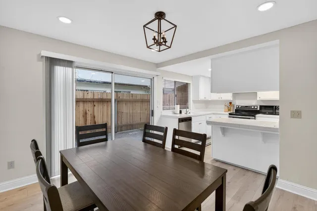 a dining room with furniture and window