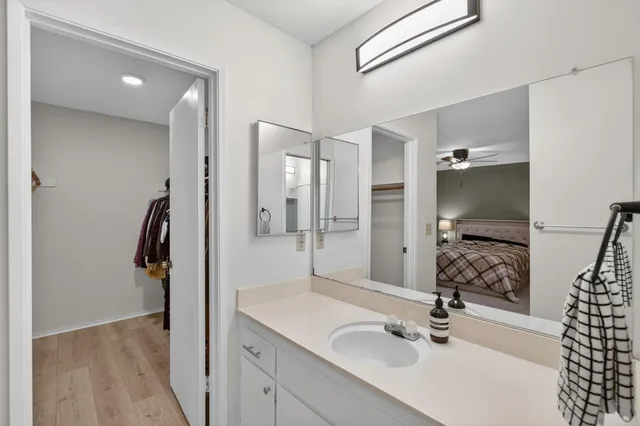 a bathroom with a sink and mirror