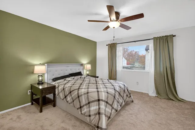 a bedroom with a bed and window