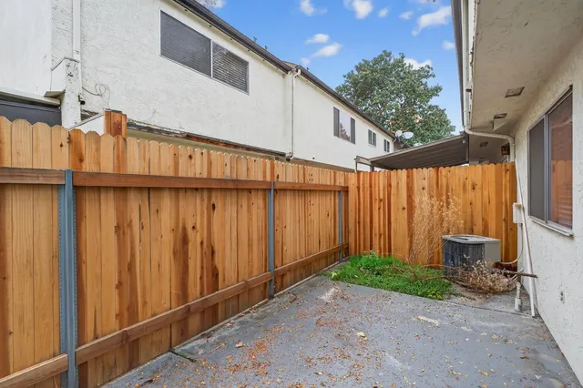 a backyard of a house with a tree