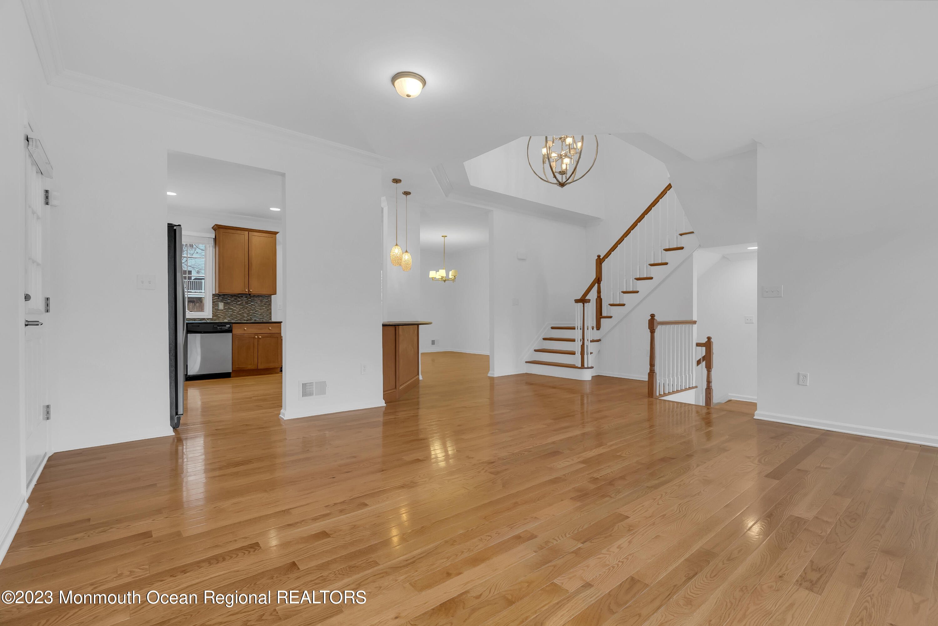 16 Mariners Bend Brielle, NJ 08730 - Photo 14 of 66 a view of an empty room with wooden floor and a window