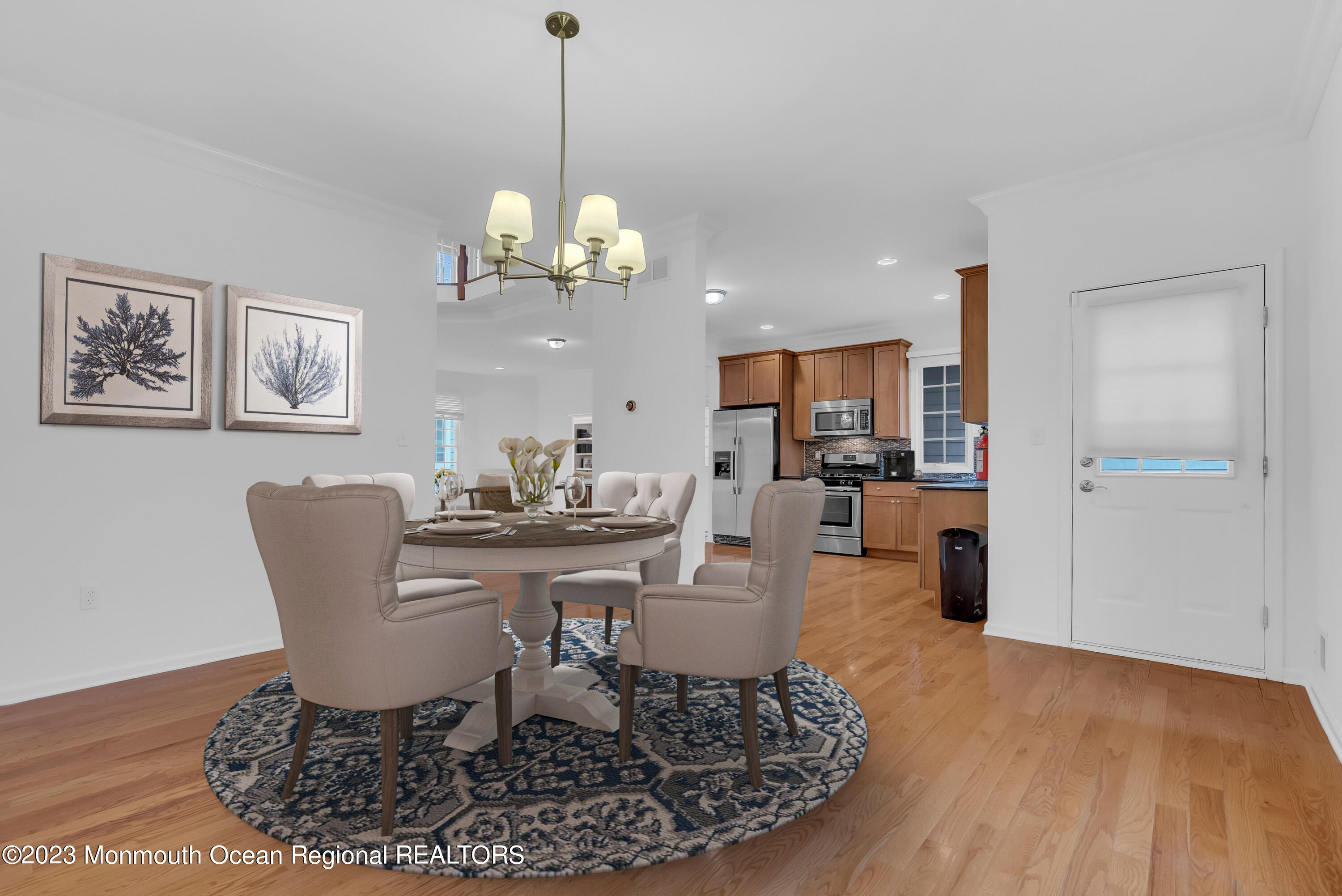 16 Mariners Bend Brielle, NJ 08730 - Photo 15 of 66 a view of a dining room with furniture a chandelier and wooden floor