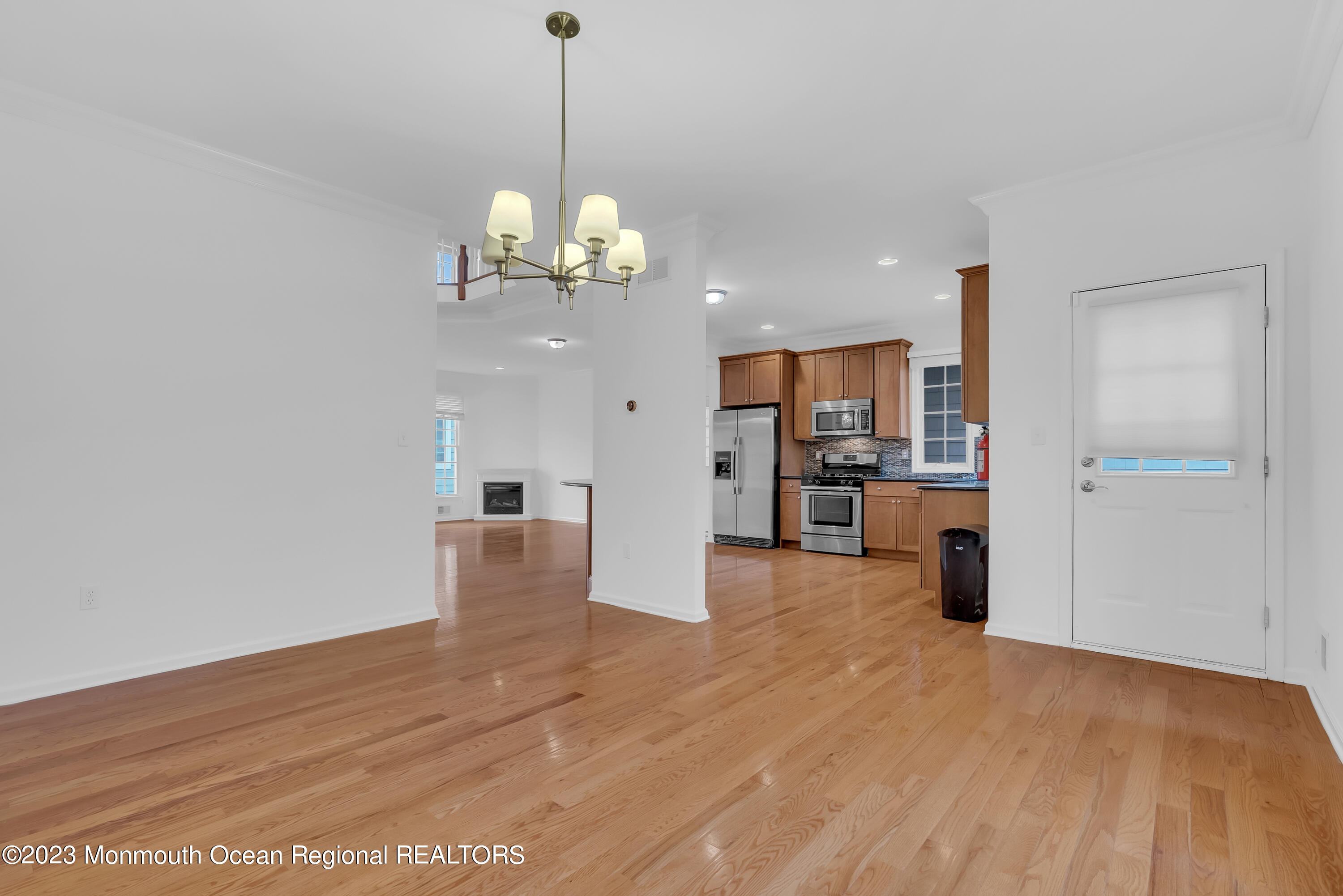 16 Mariners Bend Brielle, NJ 08730 - Photo 65 of 66 a view of a room with wooden floor and kitchen view