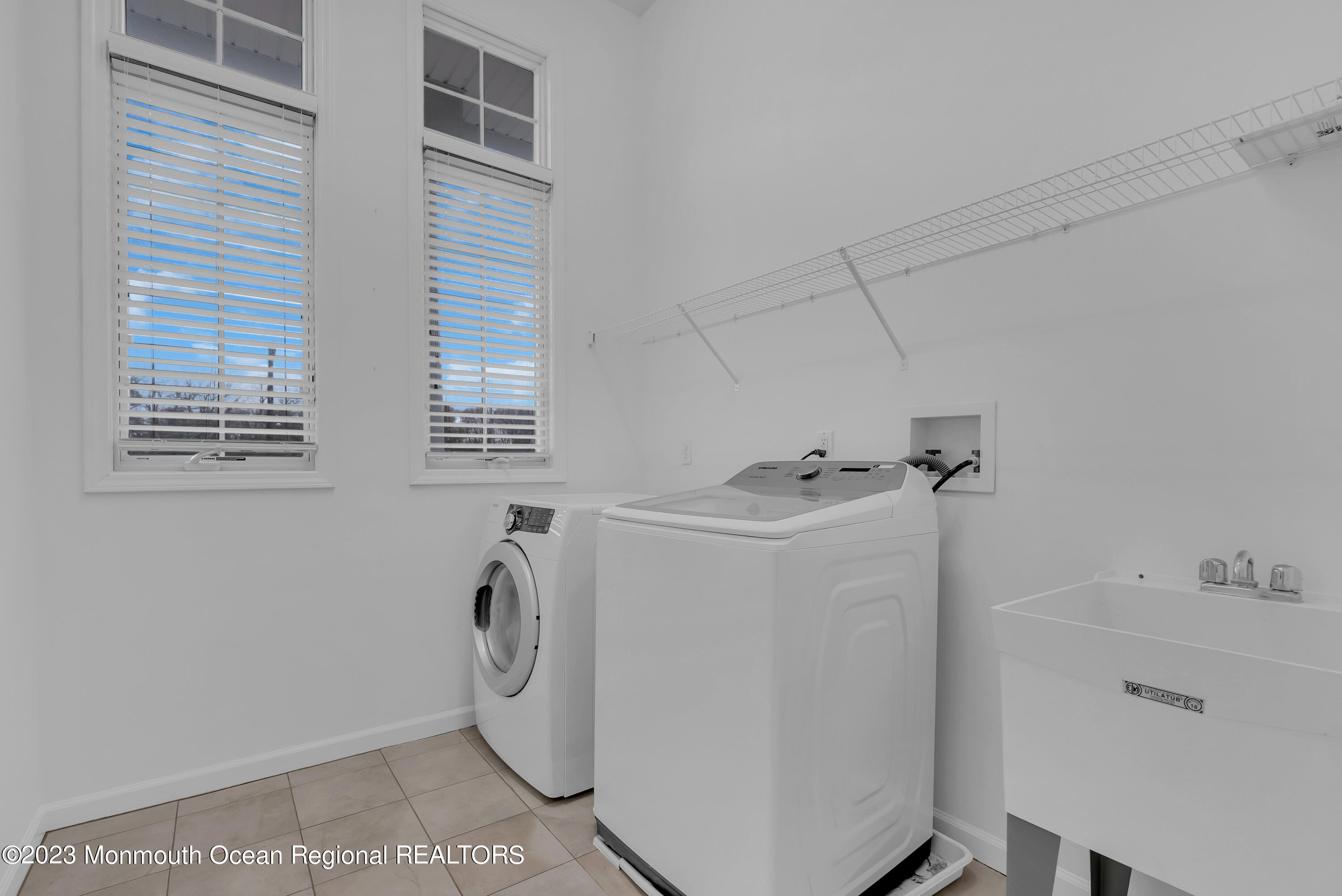 16 Mariners Bend Brielle, NJ 08730 - Photo 24 of 66 a utility room with dryer and washer