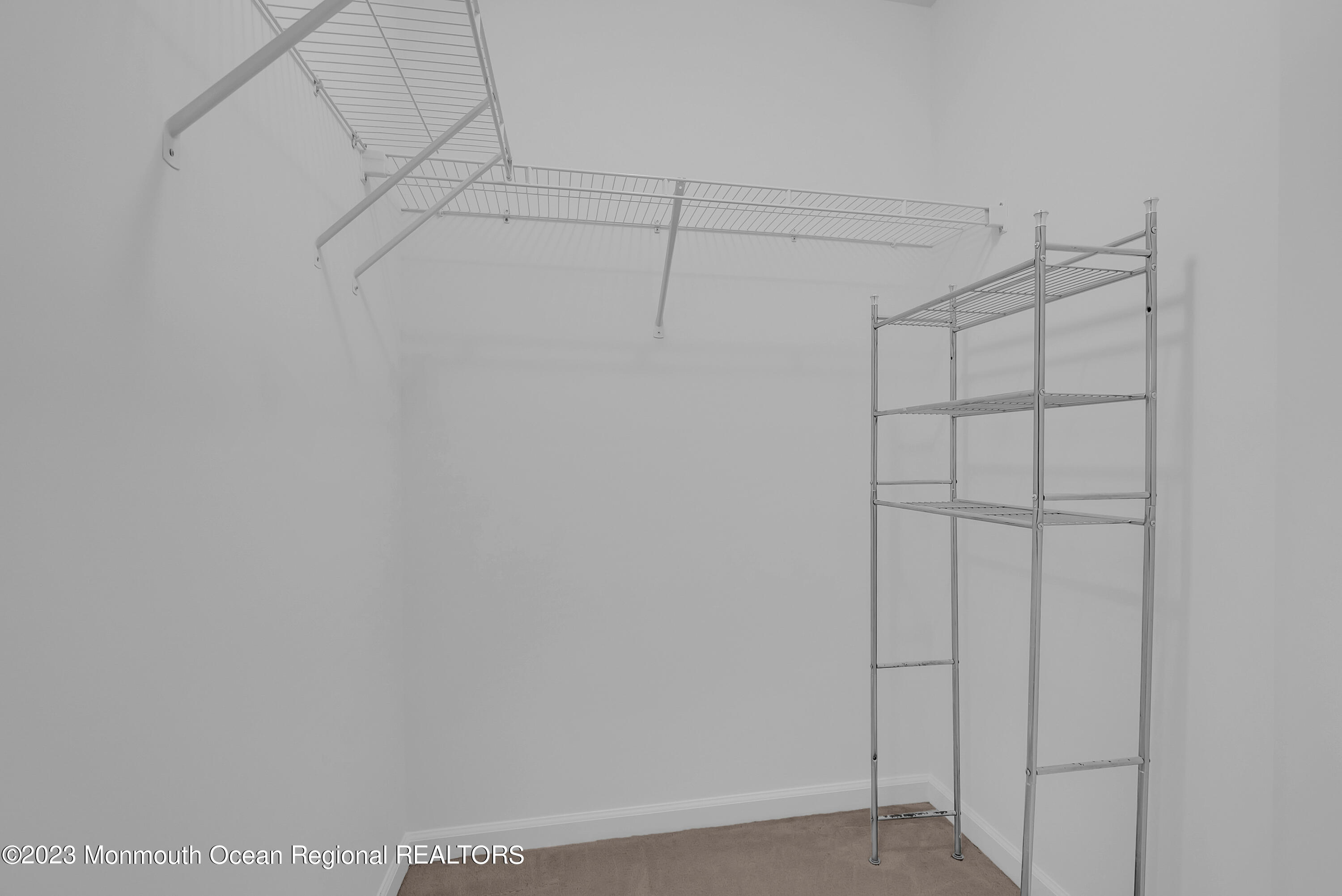 16 Mariners Bend Brielle, NJ 08730 - Photo 30 of 66 a view of a room with racks on the wall