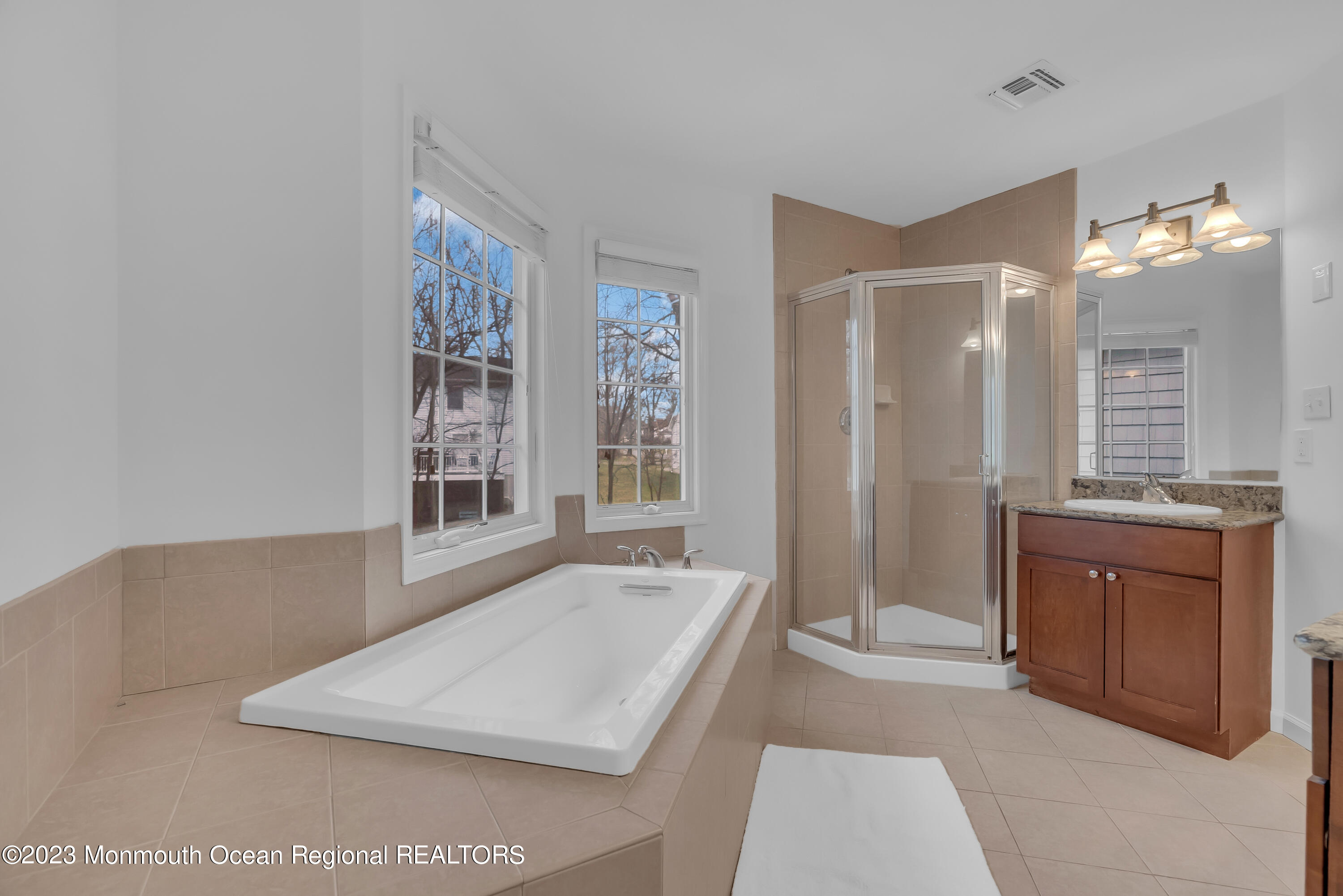 16 Mariners Bend Brielle, NJ 08730 - Photo 37 of 66 a spacious bathroom with a double vanity sink a mirror and a shower