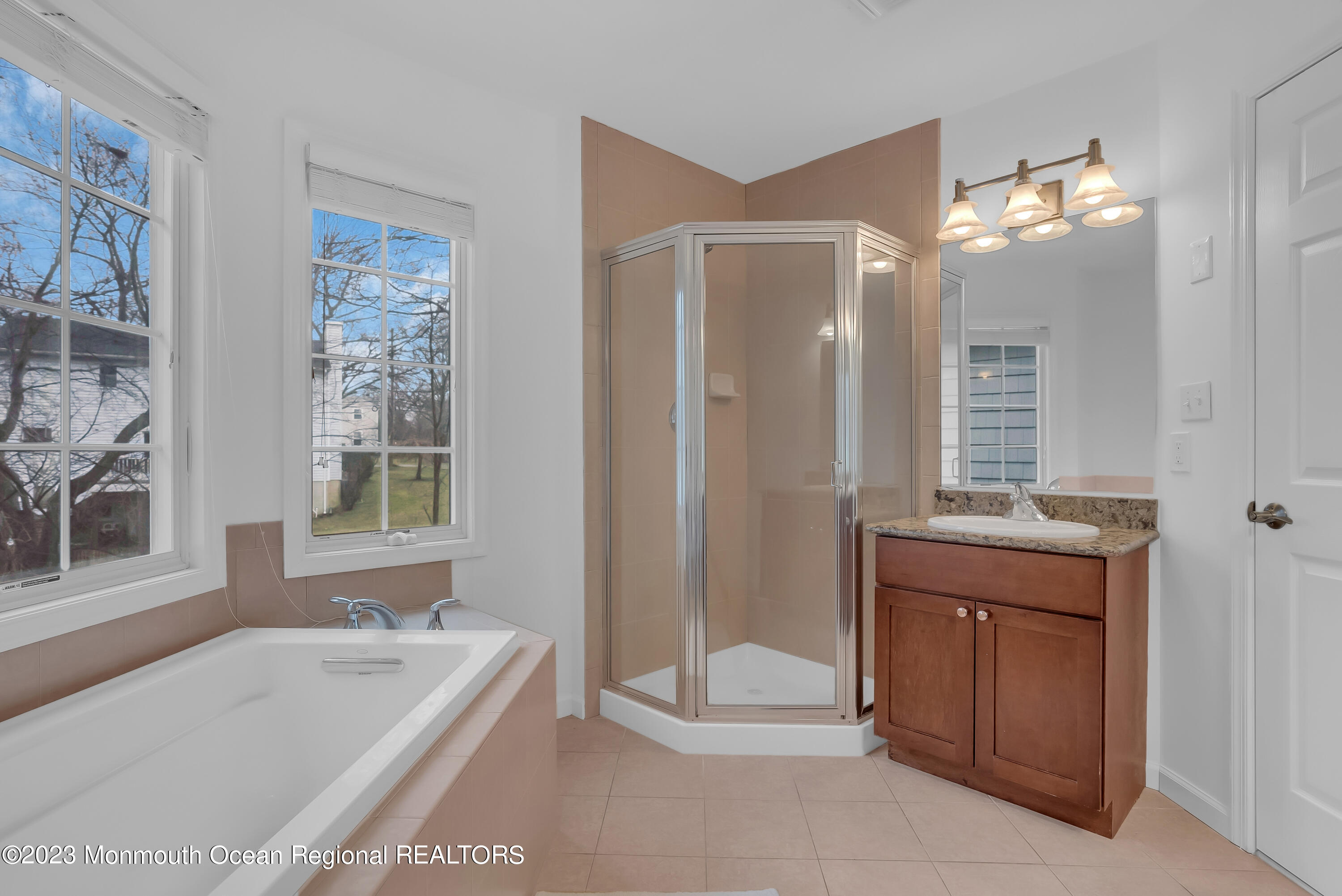 16 Mariners Bend Brielle, NJ 08730 - Photo 38 of 66 a spacious bathroom with a tub sink and mirror