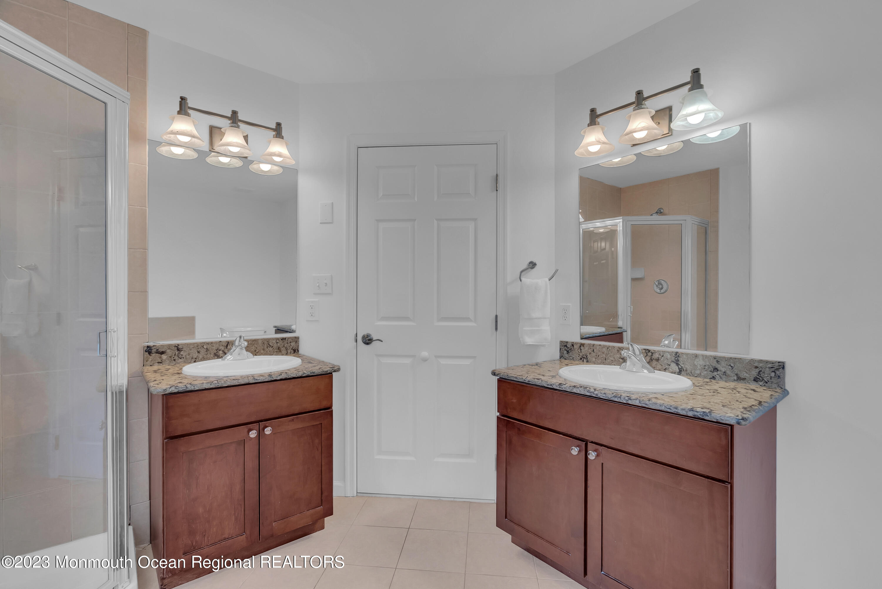 16 Mariners Bend Brielle, NJ 08730 - Photo 40 of 66 a bathroom with a sink vanity and mirror