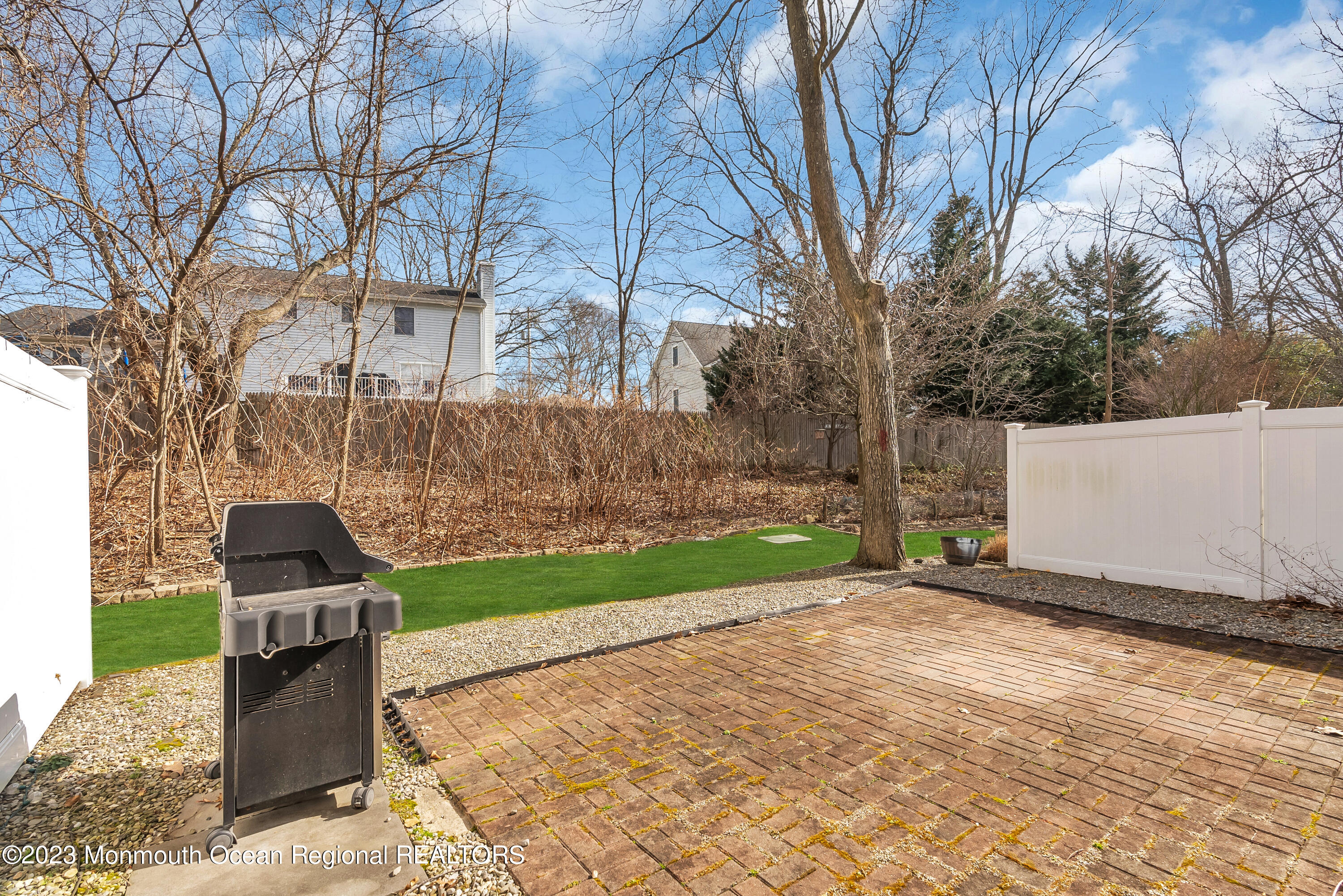 16 Mariners Bend Brielle, NJ 08730 - Photo 52 of 66 a backyard of a house with lots of green space