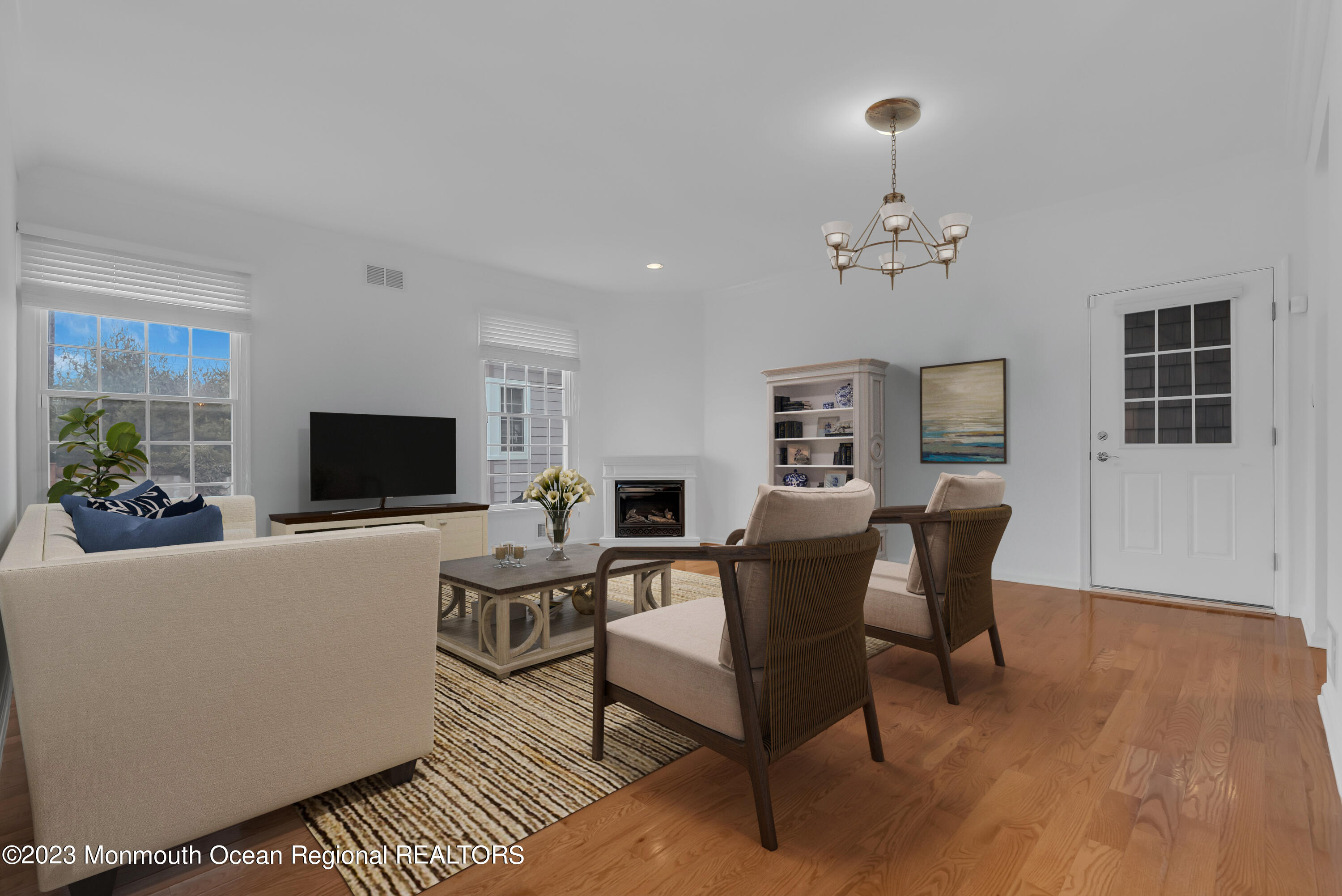 16 Mariners Bend Brielle, NJ 08730 - Photo 10 of 66 a living room with furniture a flat screen tv and a fireplace
