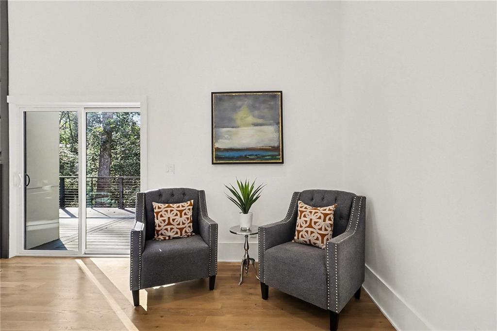3134 West Roxboro Road Northeast Atlanta, GA 30324 - Photo 19 of 62 a living room with furniture and a large window