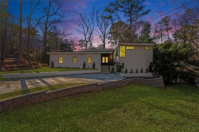 a front view of a house with garden