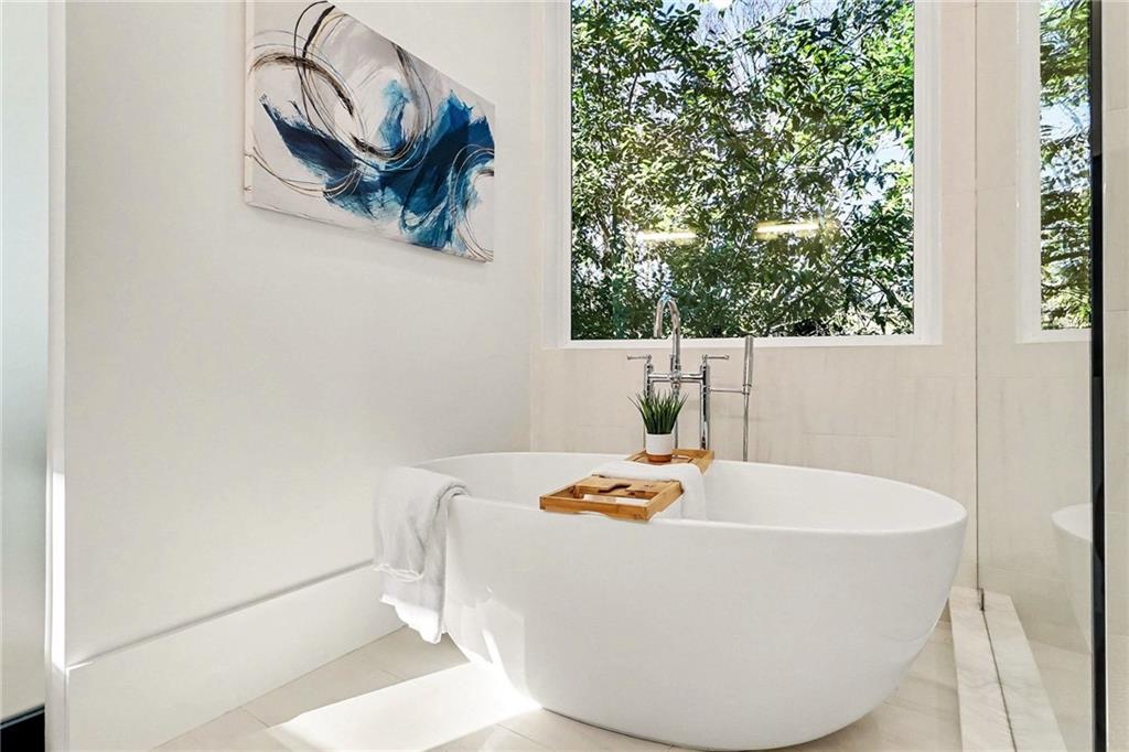 3134 West Roxboro Road Northeast Atlanta, GA 30324 - Photo 26 of 62 a white bath tub sitting in a bathroom