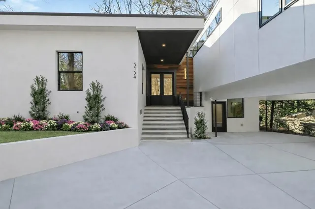 a kitchen with a sink appliances and cabinets