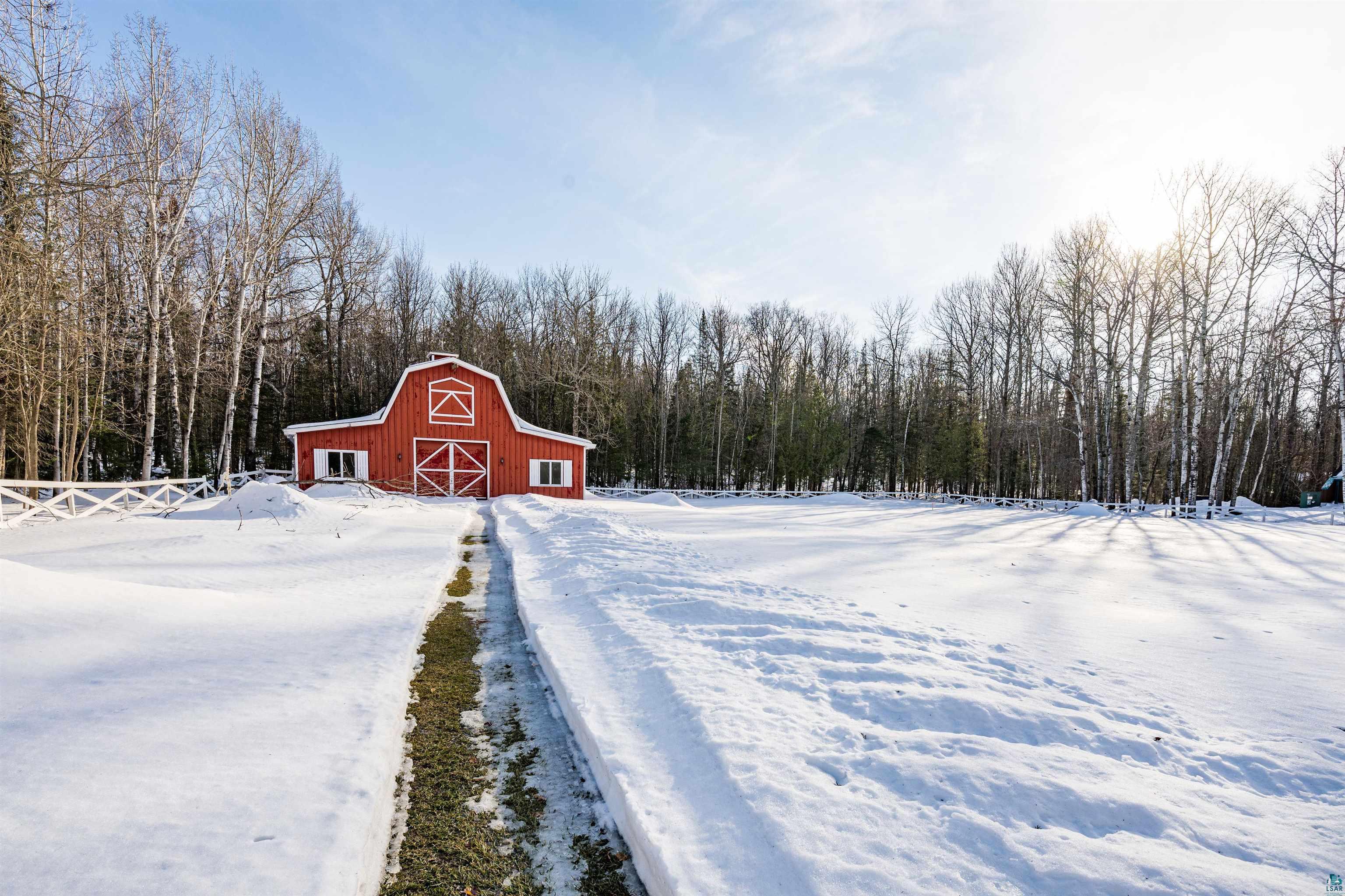5781 South Pike Lake Road Duluth, MN 55811 - Photo 42 of 42 Snow covered structure with a barn and a wooded view
