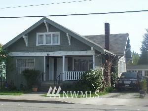 220 Park Renton Wa 98055 Renton, WA 98057 - Photo 1 of 1 a front view of a house with a yard
