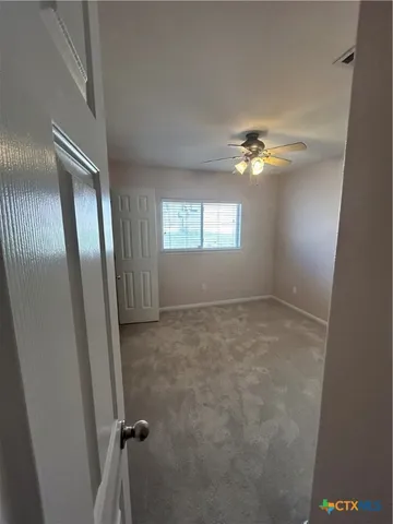 a bathroom with a tub a sink and a mirror
