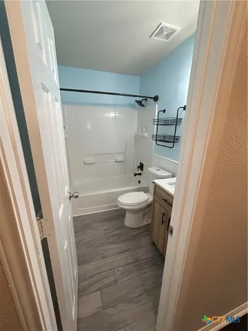 a kitchen with stainless steel appliances a refrigerator sink and microwave