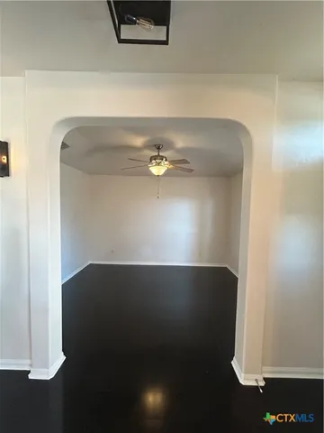 a view of kitchen with a sink a refrigerator and window