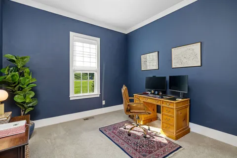 a bedroom with bed and a window