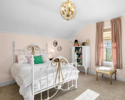 a bedroom with furniture and a closet
