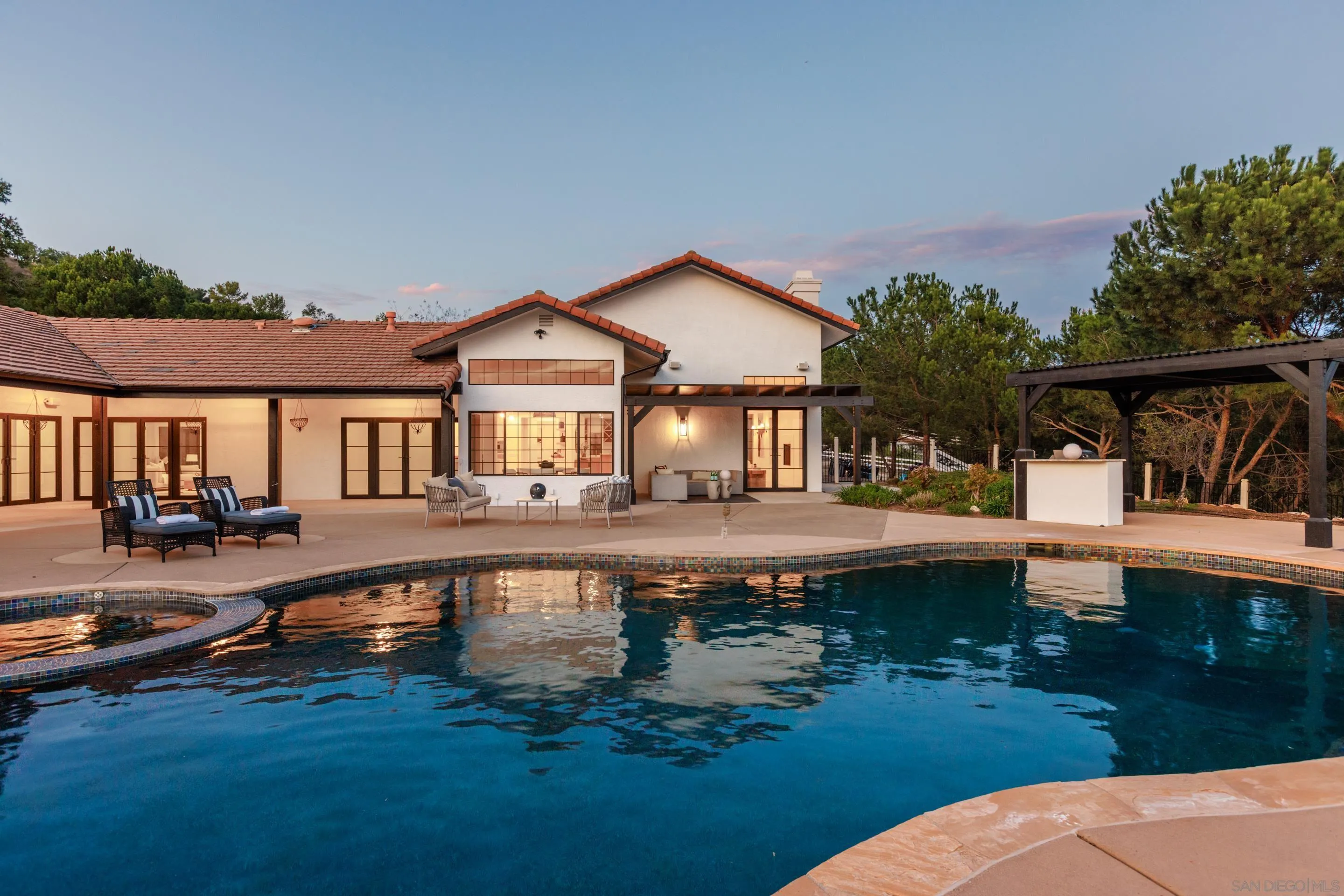 13807 Millards Ranch Lane Poway, CA 92064 - Photo 3 of 36 a front view of a house with swimming pool having outdoor seating