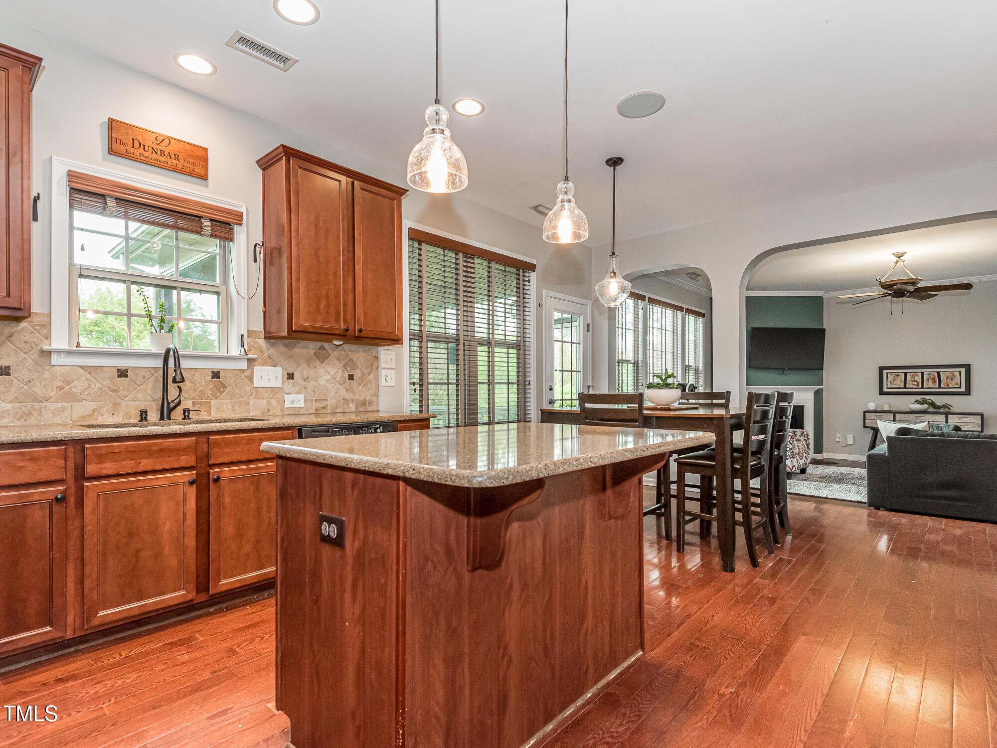 111 Gathering Place Durham, NC 27713 - Photo 12 of 44 a kitchen with lots of counter space sink and a chandelier