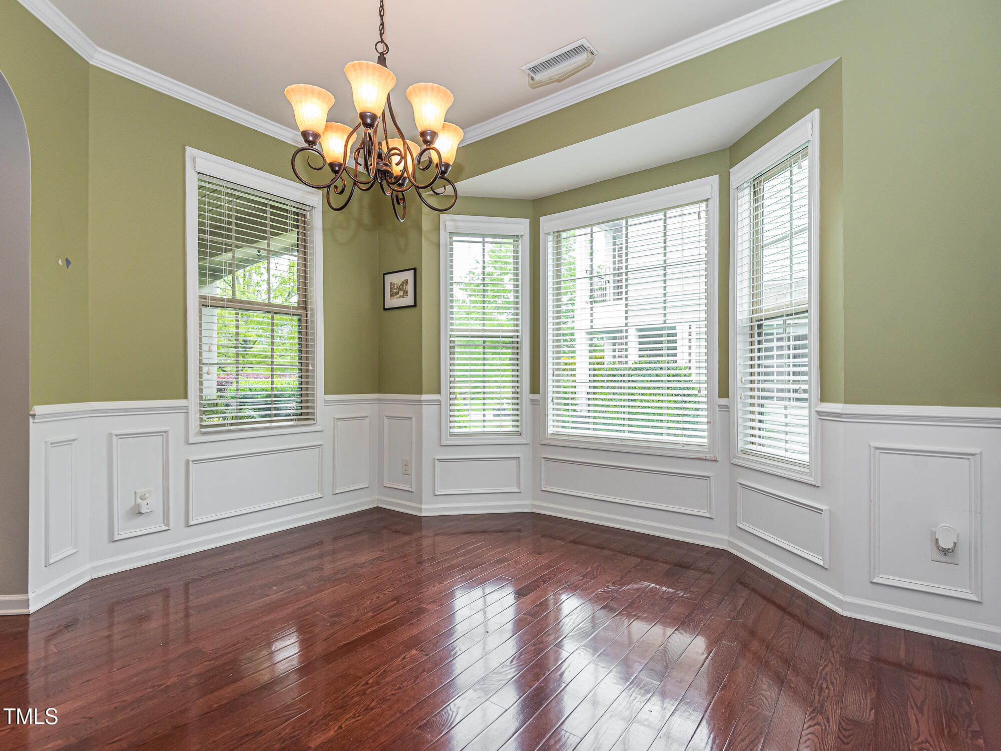 111 Gathering Place Durham, NC 27713 - Photo 20 of 44 a view of an empty room with wooden floor and a window