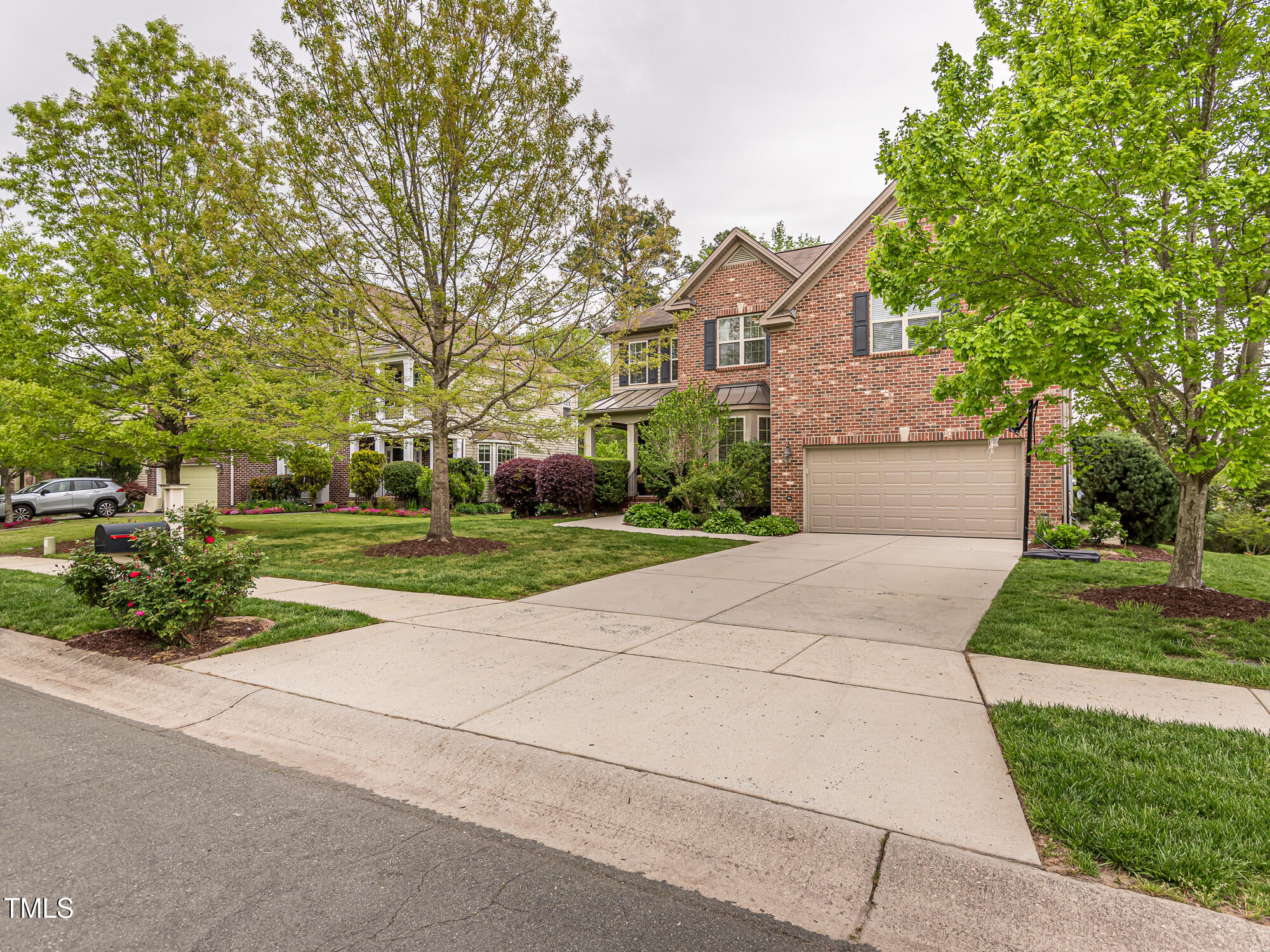 111 Gathering Place Durham, NC 27713 - Photo 2 of 44 a front view of a house with a yard and garage