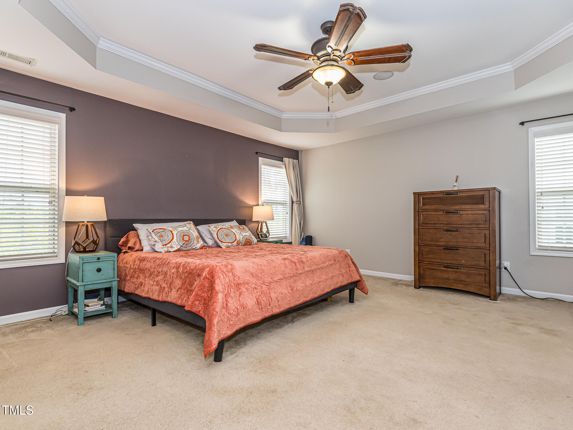 111 Gathering Place Durham, NC 27713 - Photo 21 of 44 a spacious bedroom with a bed and a ceiling fan