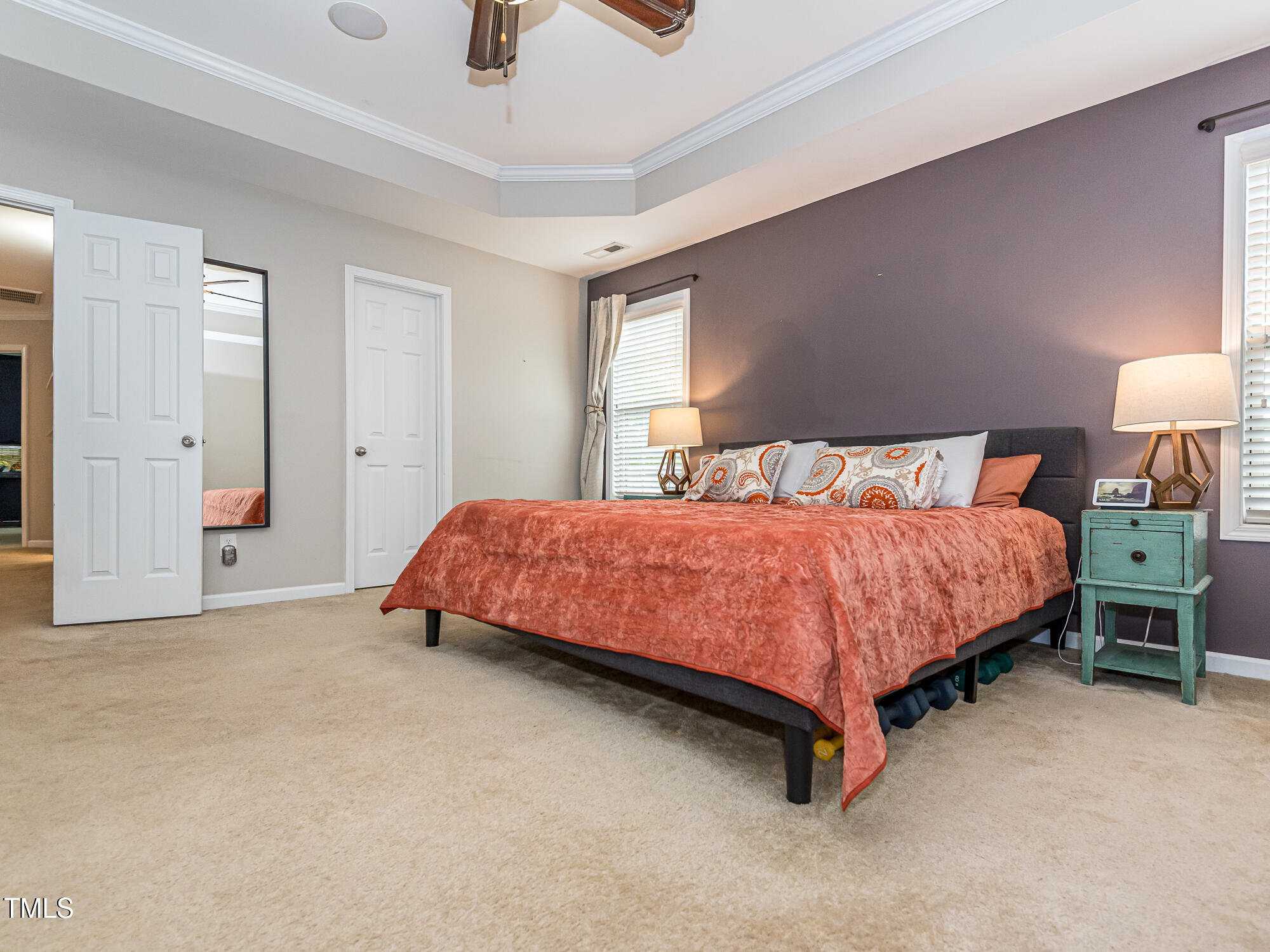 111 Gathering Place Durham, NC 27713 - Photo 22 of 44 a bedroom with a bed and a lamp on dresser