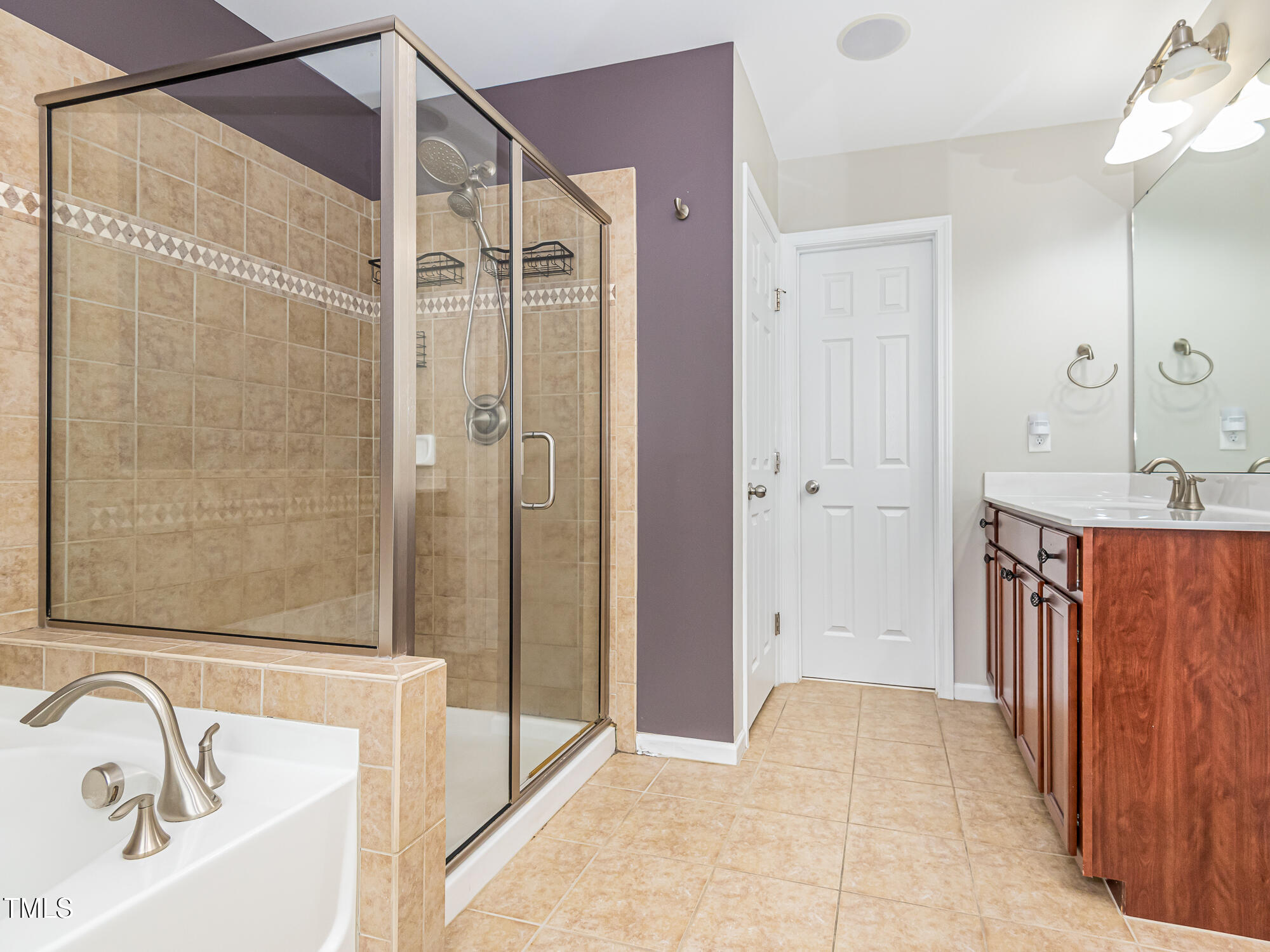 111 Gathering Place Durham, NC 27713 - Photo 24 of 44 a bathroom with a tub shower sink and vanity