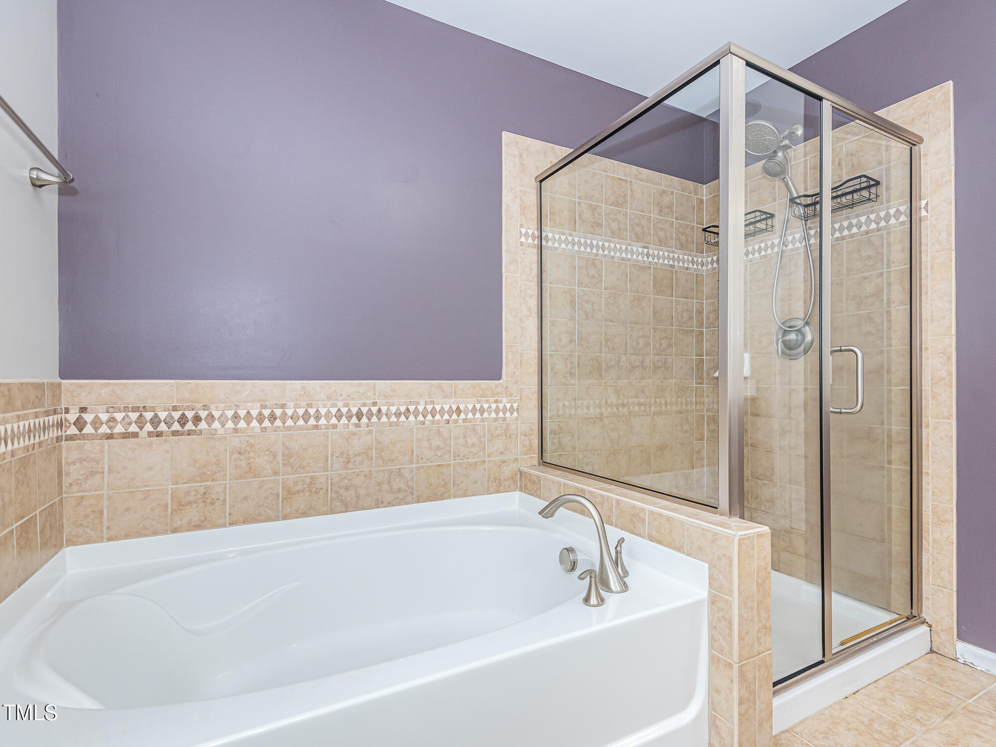 111 Gathering Place Durham, NC 27713 - Photo 25 of 44 a white bath tub sitting next to a shower