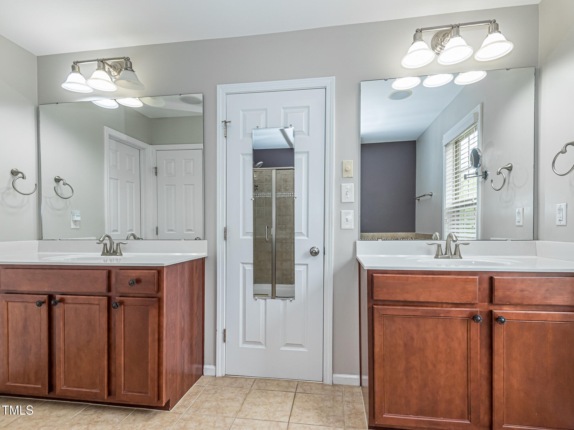 111 Gathering Place Durham, NC 27713 - Photo 26 of 44 a bathroom with a double vanity sink and a mirror