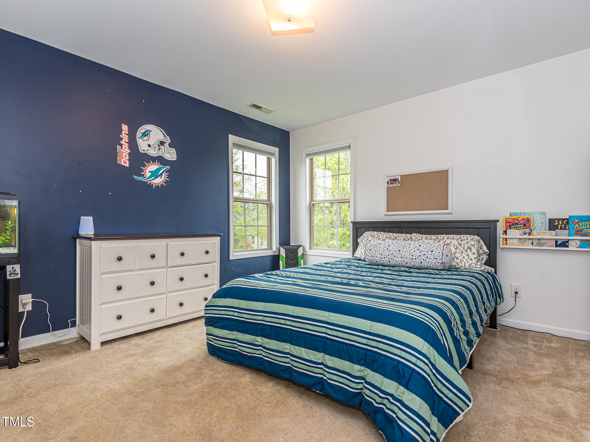 111 Gathering Place Durham, NC 27713 - Photo 27 of 44 a bedroom with a bed and a dresser in it