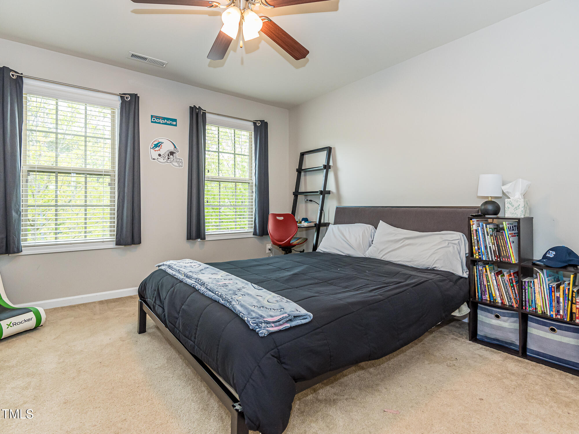 111 Gathering Place Durham, NC 27713 - Photo 28 of 44 a bedroom with a bed and a chandelier
