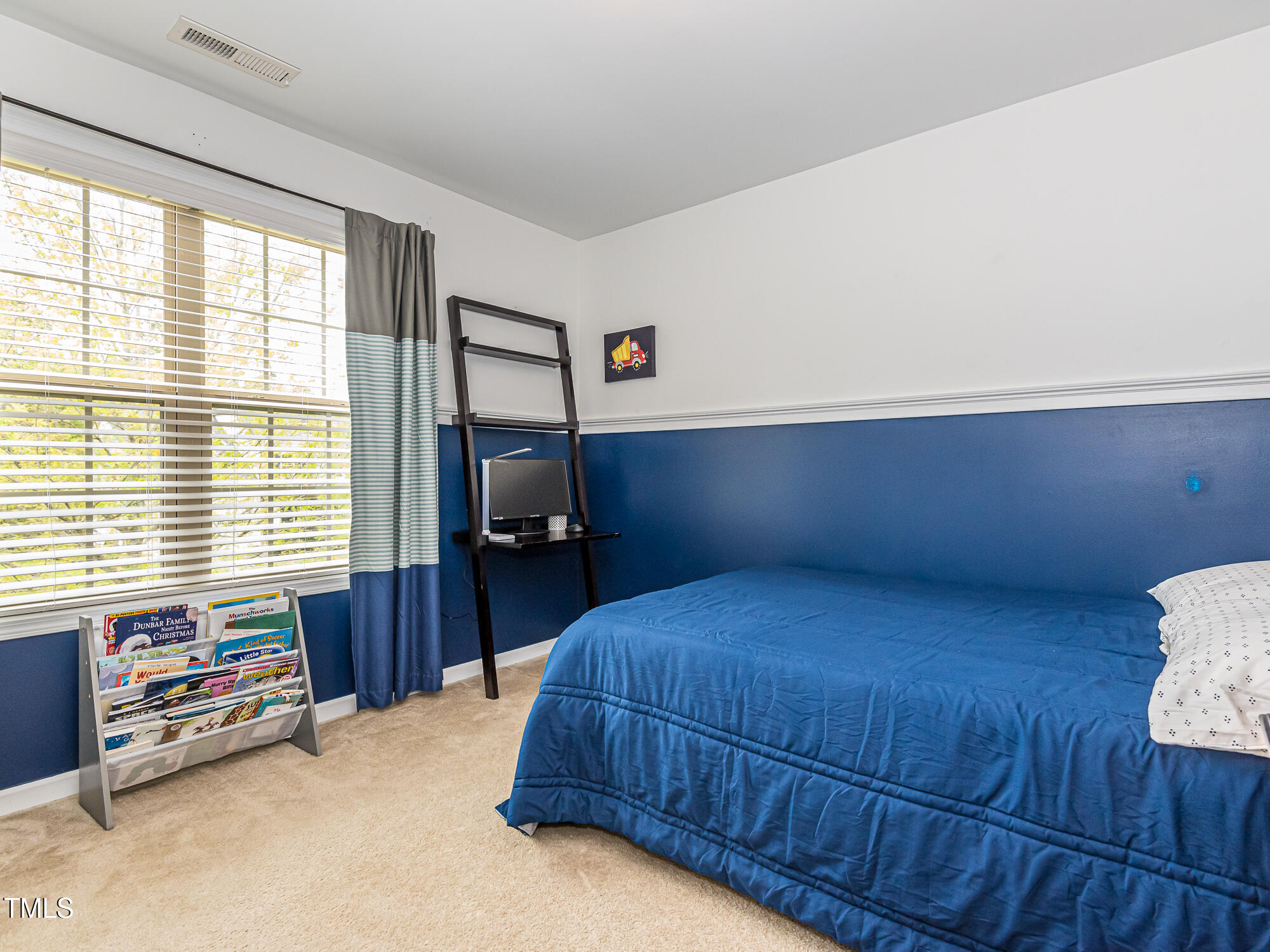 111 Gathering Place Durham, NC 27713 - Photo 29 of 44 a bedroom with a bed and a tv on table