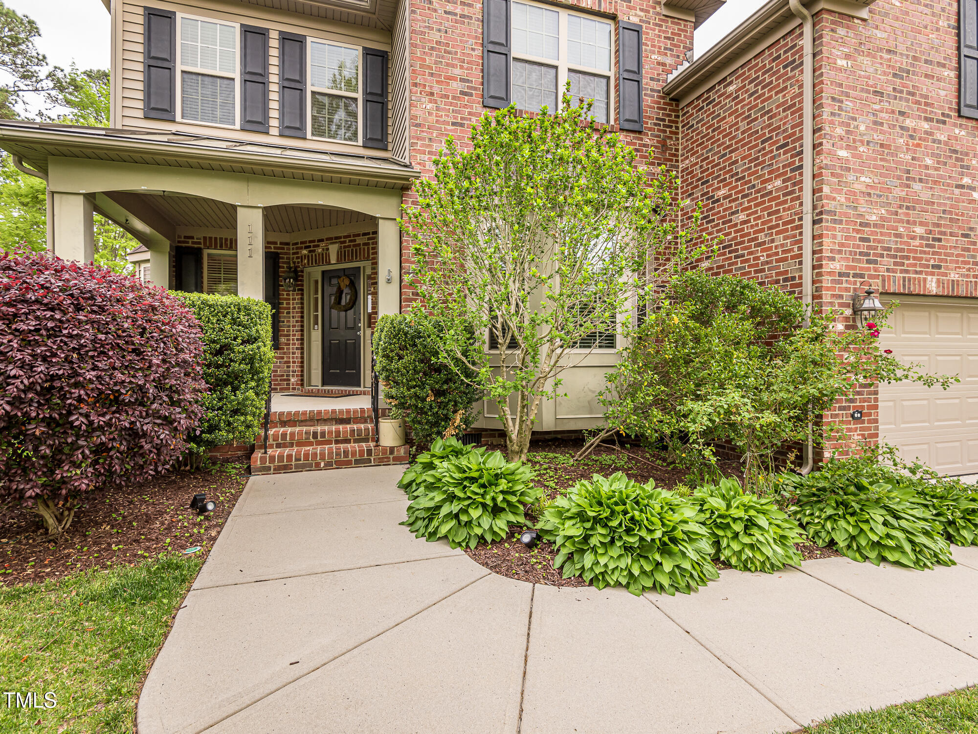 111 Gathering Place Durham, NC 27713 - Photo 3 of 44 a view of a pathway with flower plants