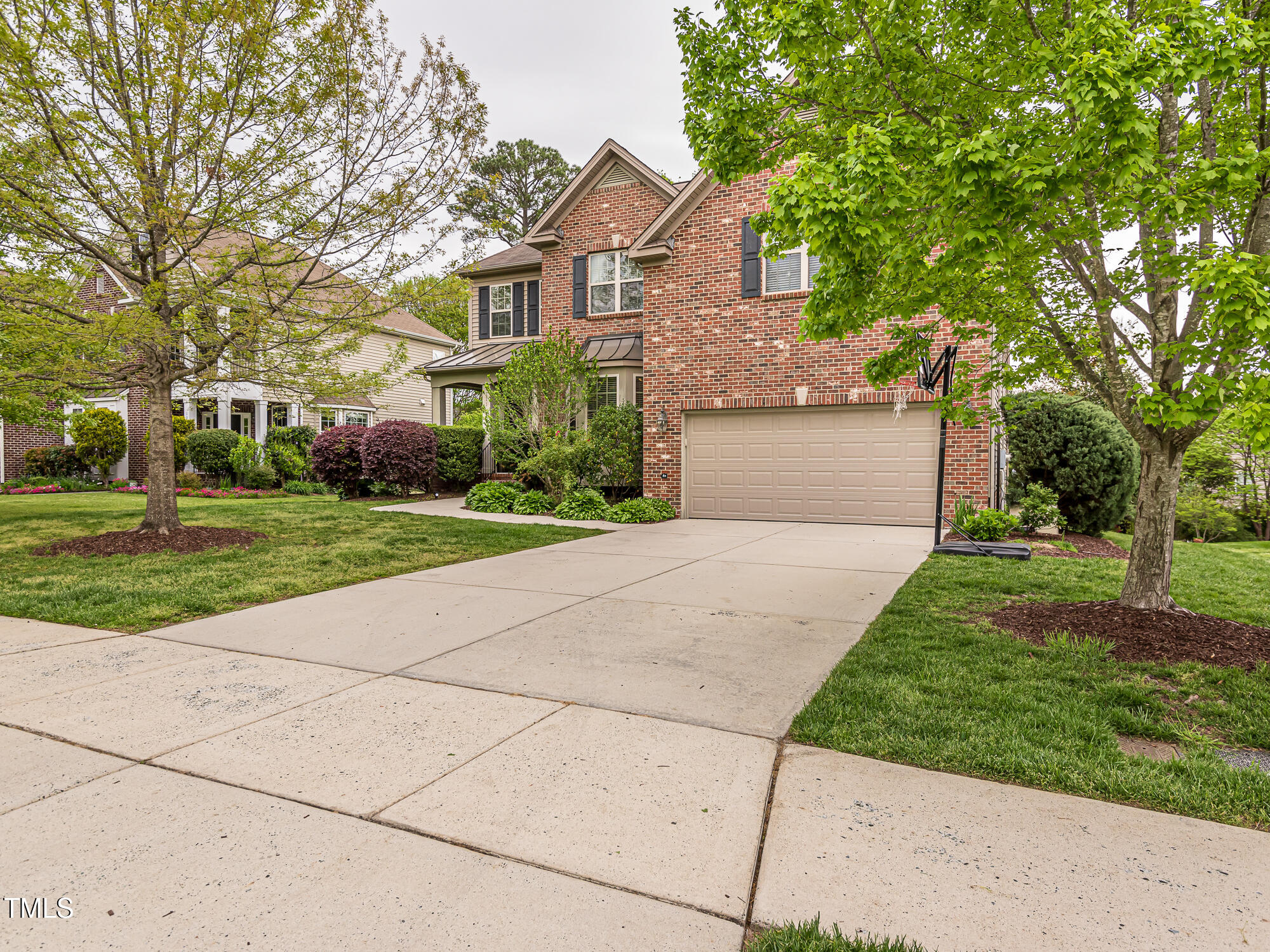 111 Gathering Place Durham, NC 27713 - Photo 37 of 44 a front view of a house with a yard and trees