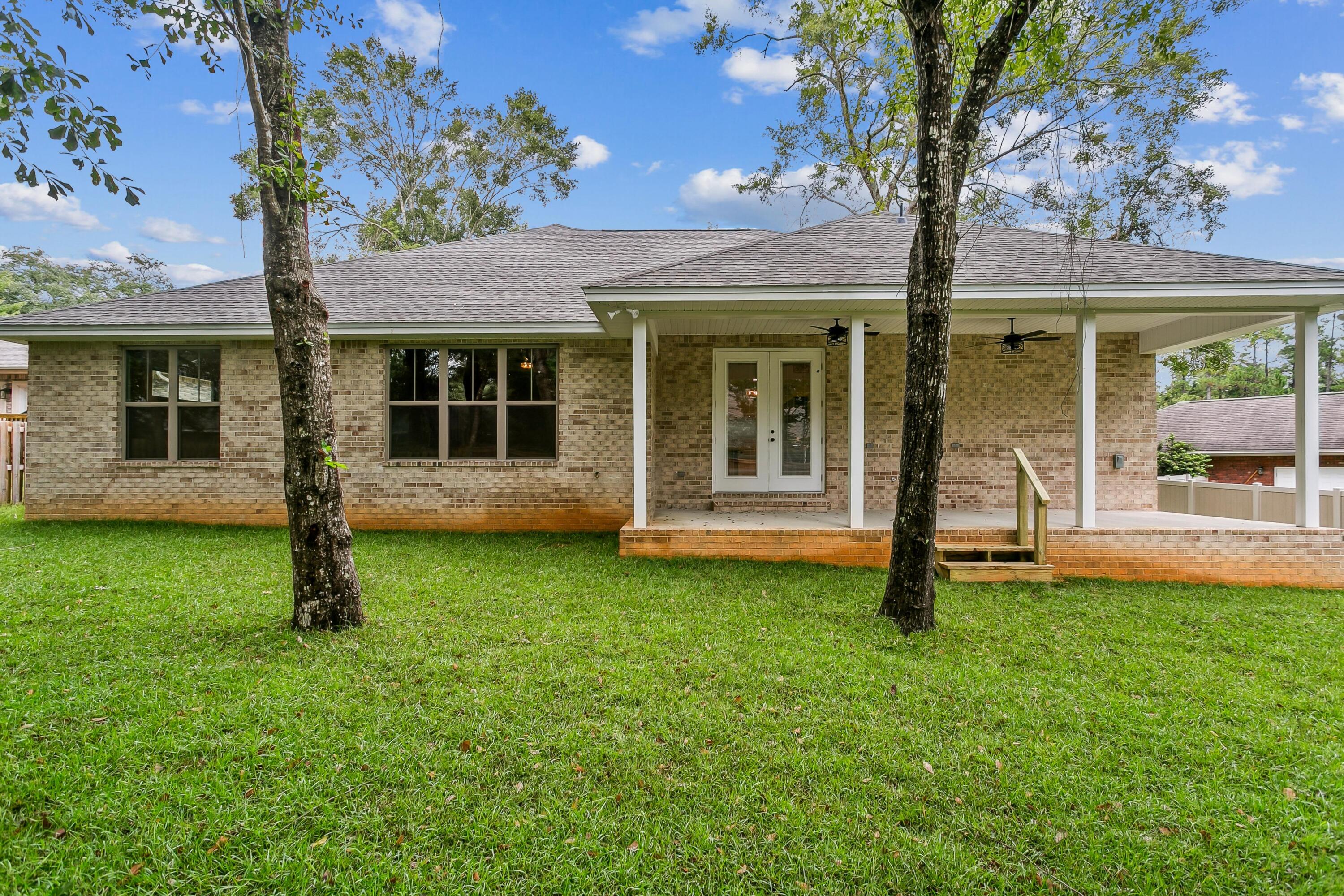 4567 Pfitzer Circle Crestview, FL 32536 - Photo 9 of 33 4567 Pfitzer back porch