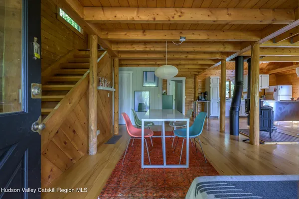 a view of living room filled with furniture and wooden floor