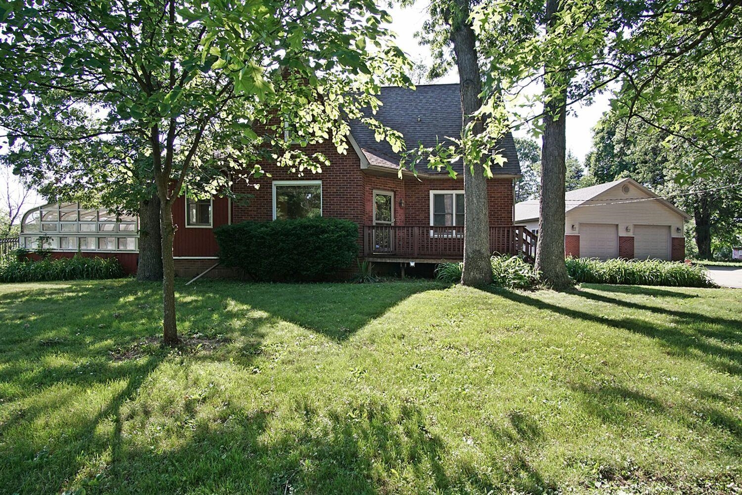 12932 Cedar Lake Road Crown Point, IN 46307 - Photo 3 of 10 a house view with a garden space
